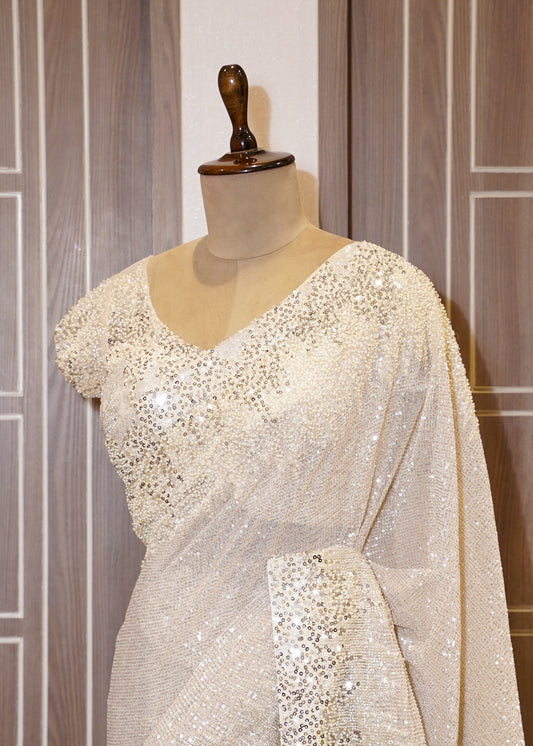 Ivory Sequence Saree with Hand Embroidered Border and Stitched Blouse
