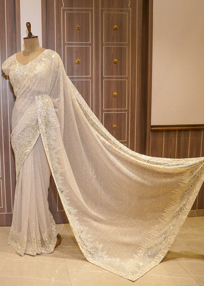 Ivory Sequence Saree with Hand Embroidered Border and Stitched Blouse